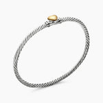 Sterling Silver Cable bracelet with a yellow gold heart in the center 