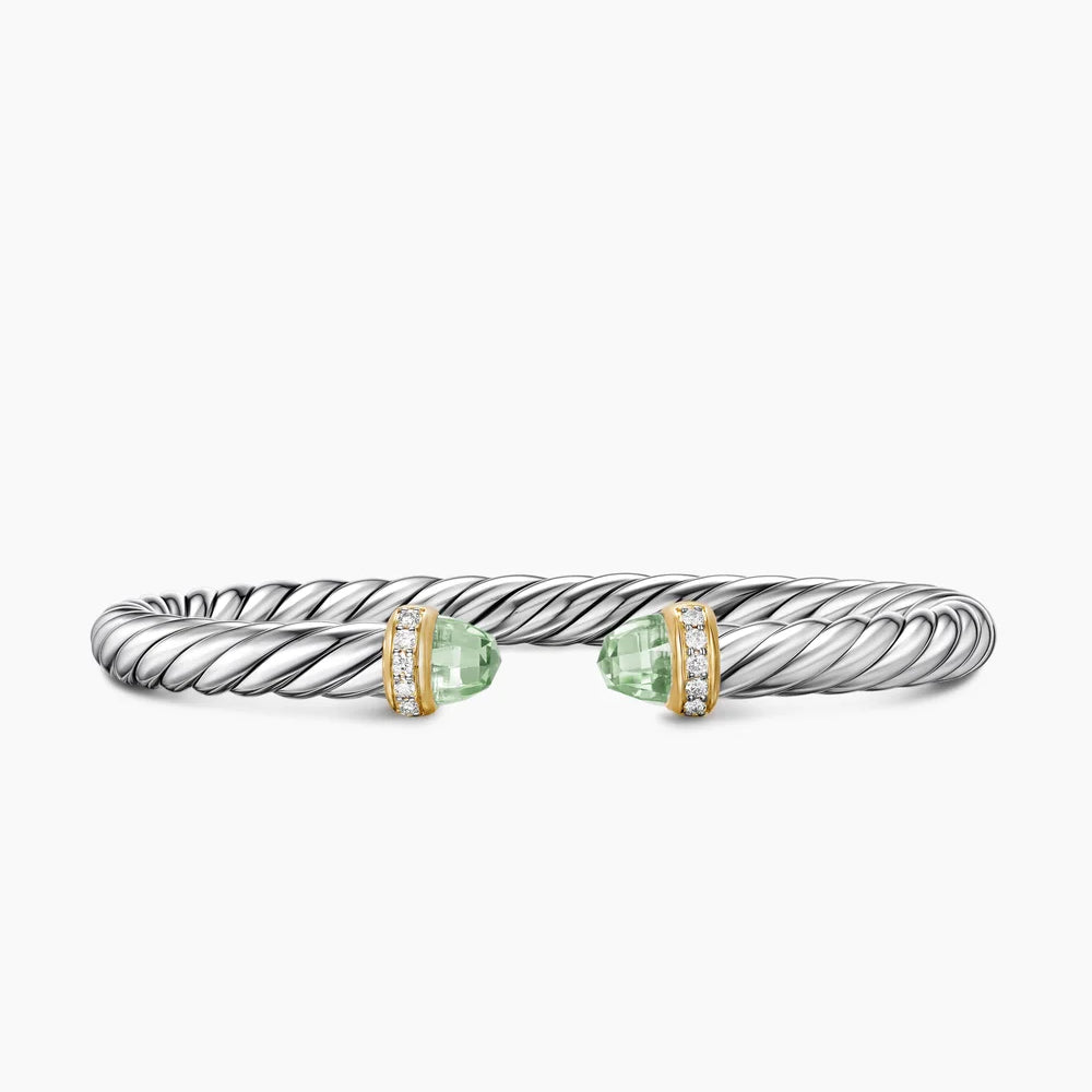 Silver bracelet with green gemstones on a white background featuring both Yellow Gold and Diamond on End Caps.
