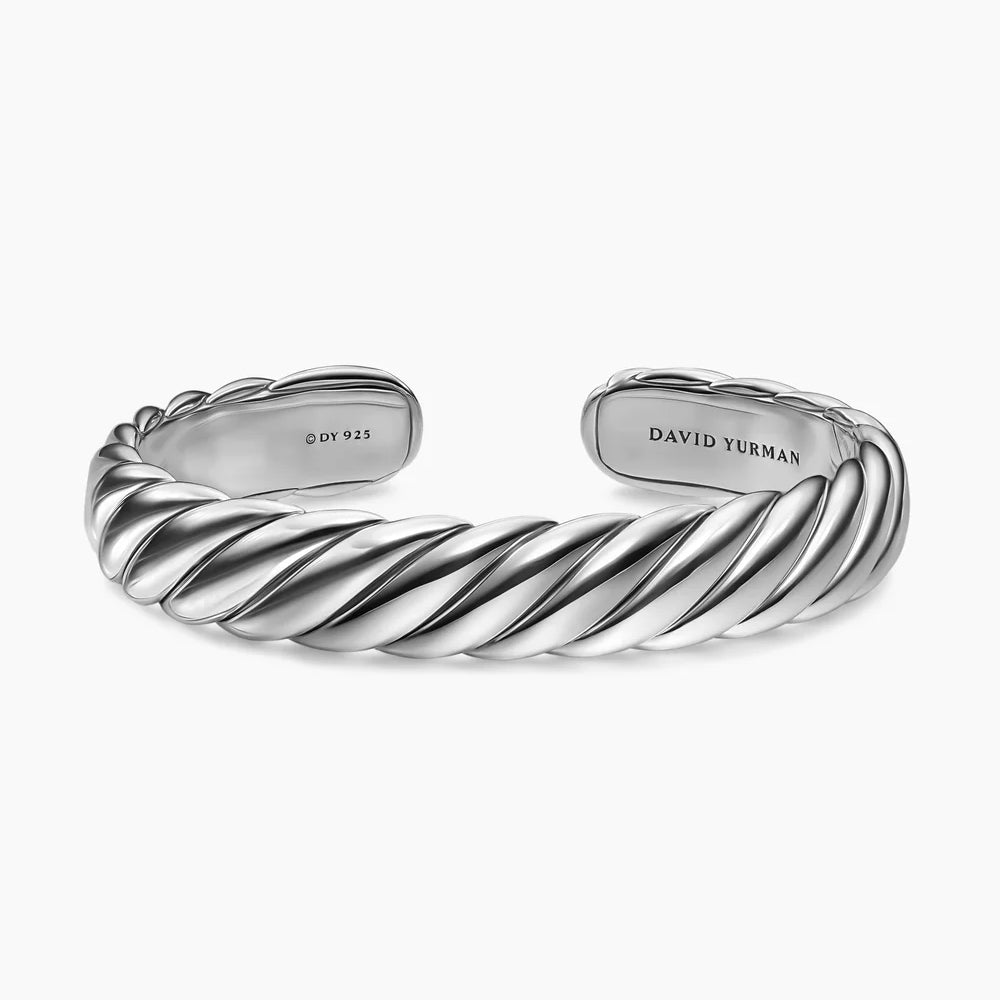 Polished sterling silver cuff bracelet featuring a twisted cable-inspired design with an open-back silhouette and rounded ends.