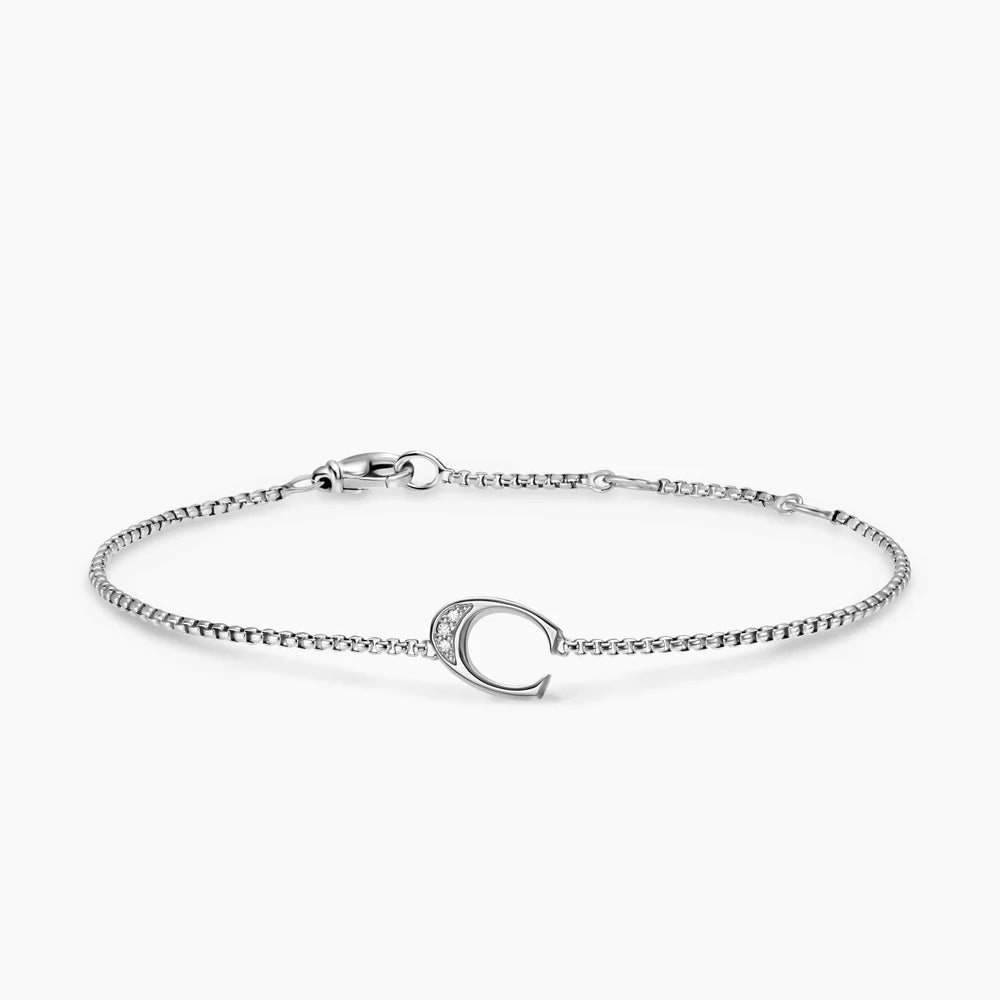 Silver bracelet with a small C initial Charm with Diamond on a white background