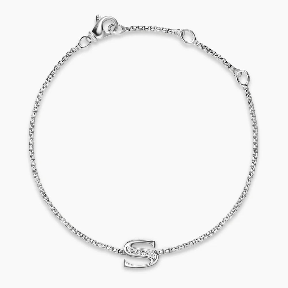 Silver bracelet with a letter 'S' charm on a white background