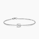 Silver bracelet with a letter 'S' charm on a white background