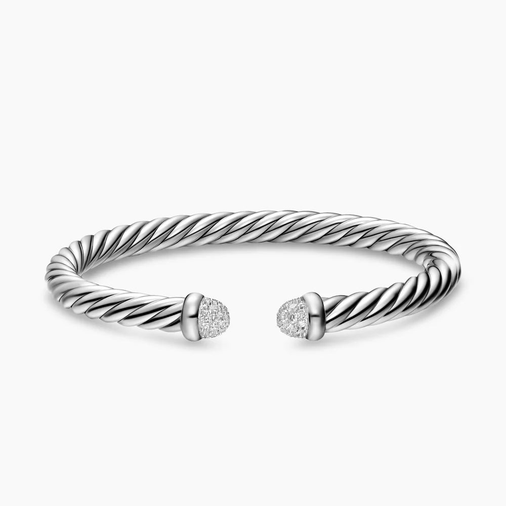 Silver bracelet with diamond accents on a white background