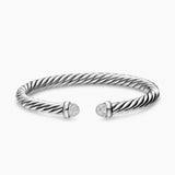 Silver bracelet with diamond accents on a white background