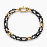Top view Black titanium with 18-karat yellow gold chain link Bracelet on a white background