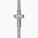 Silver Chain Bracelet with a cross in the center of the piece layed out on a white background.