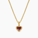 Read Heart Necklace on a Yellow Gold Chain and White Background.