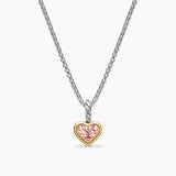 Heart-shaped pendant with pink gemstone on a chain against a white background