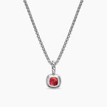 Back of the Amulet with red garnet gemstone and gold and silver accents on a white background on silver chain