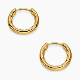 Yellow gold hoop huggie earrings with a smooth polished exterior and a cable texture on the inside of the hoop. 