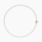 delicate pearl necklace with a gold clasp on a white background 