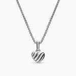 Sterling silver necklace with a small puffy heart charm