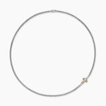 Silver box chain necklace with a gold cross pendant on a white background