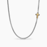 Silver box chain necklace with a gold cross pendant on a white background