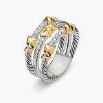 one stacked ring made up of three gold and silver bands stacked on a white background.