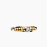 Gold cable band ring with a diamond x  in the center 