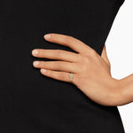 hand wearing a Rose gold ring with pave diamonds with a textured cable on her pinky finger 